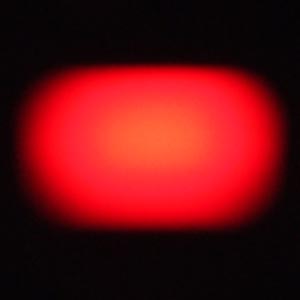 an oval red magnified standby light