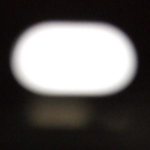 a white oval magnified standby light